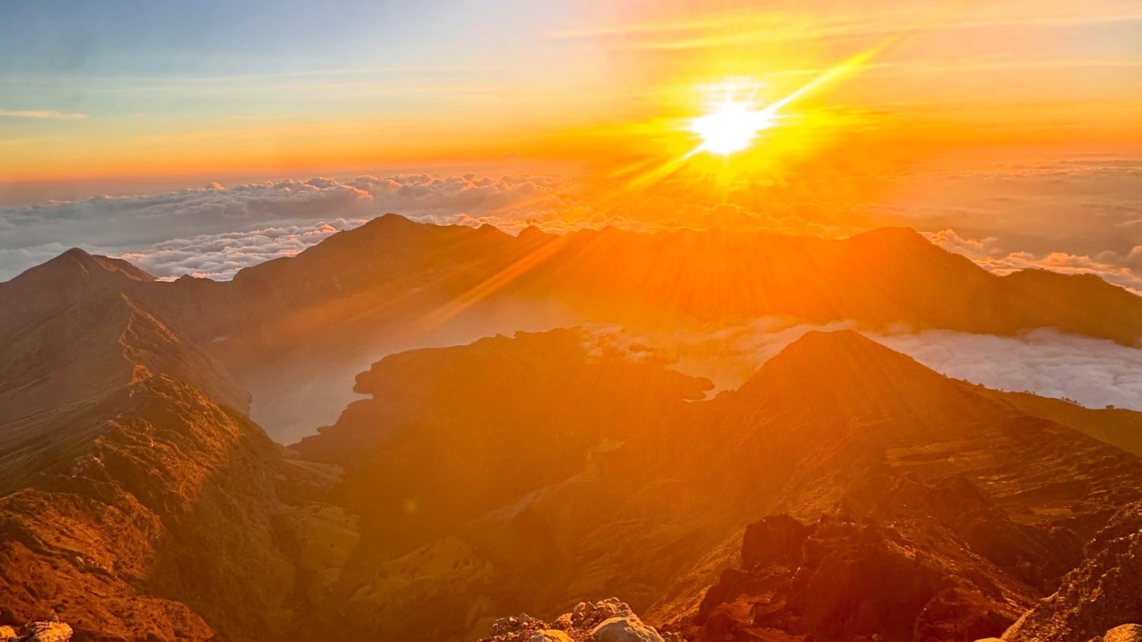 Majestic panoramic shot of Mount Rinjani summit with clouds